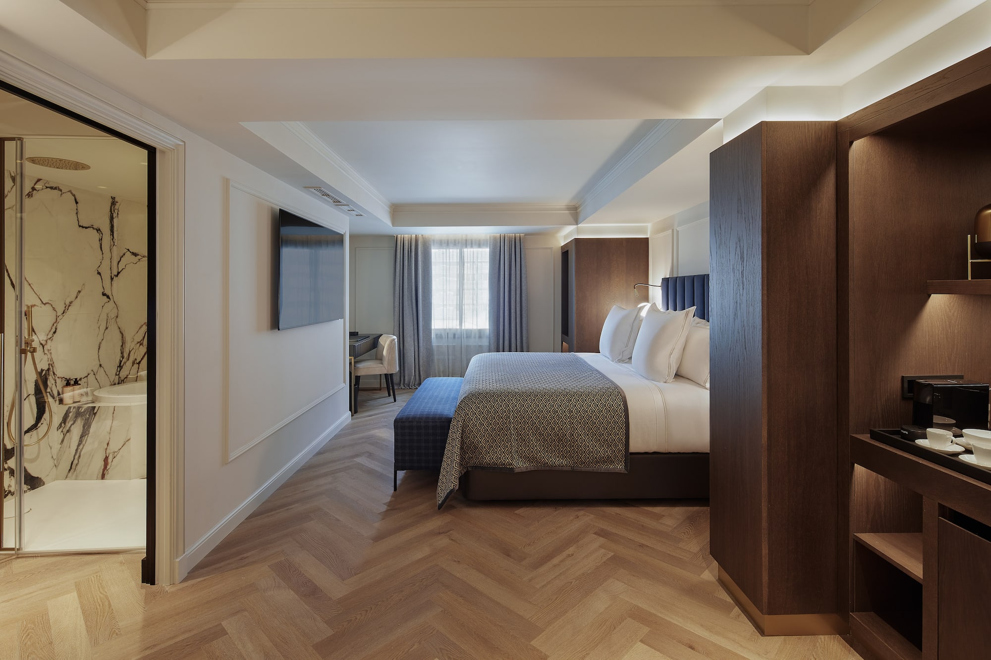 a room with a bed and a tv