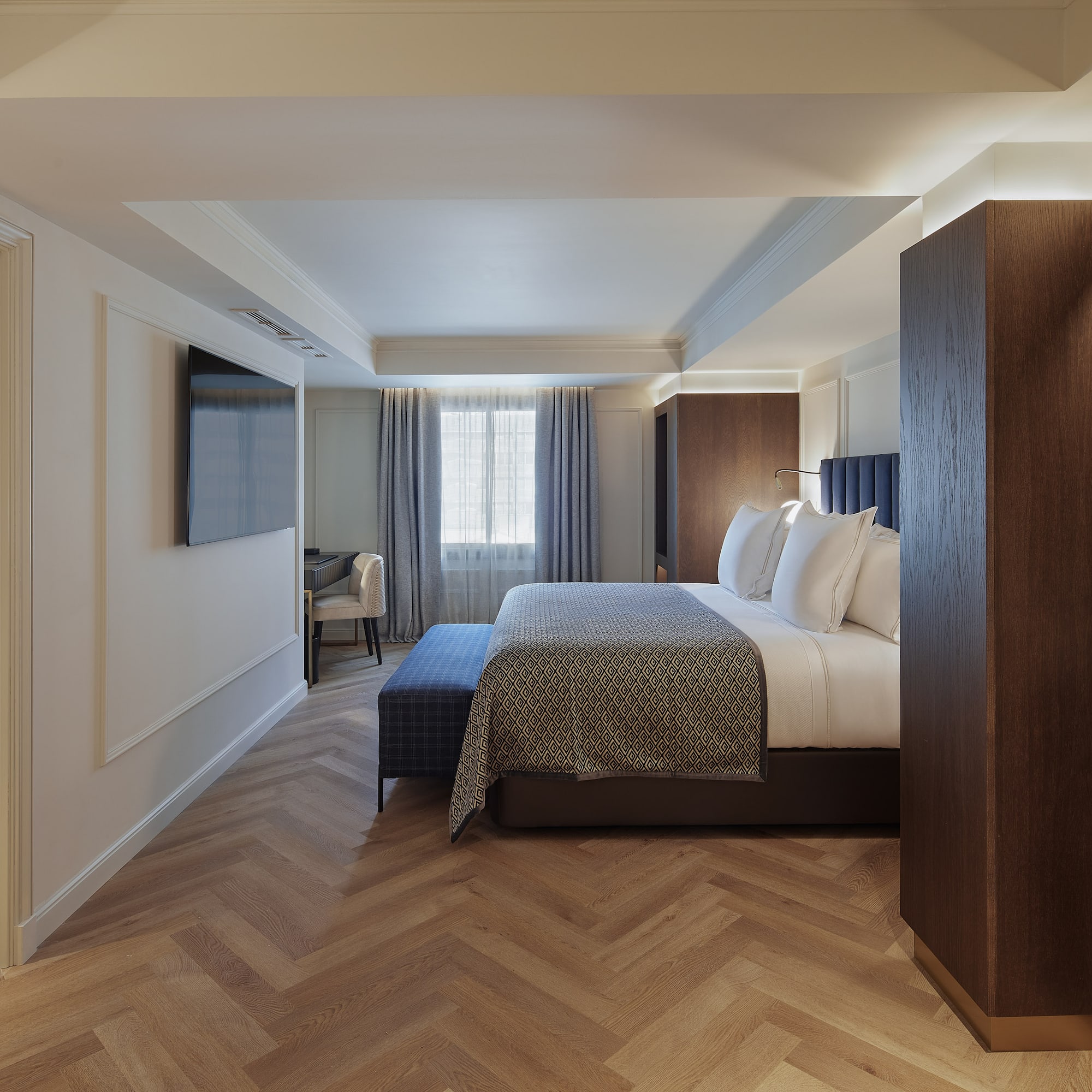 a room with a bed and a tv