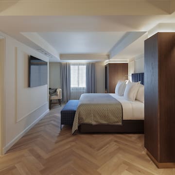 a room with a bed and a tv