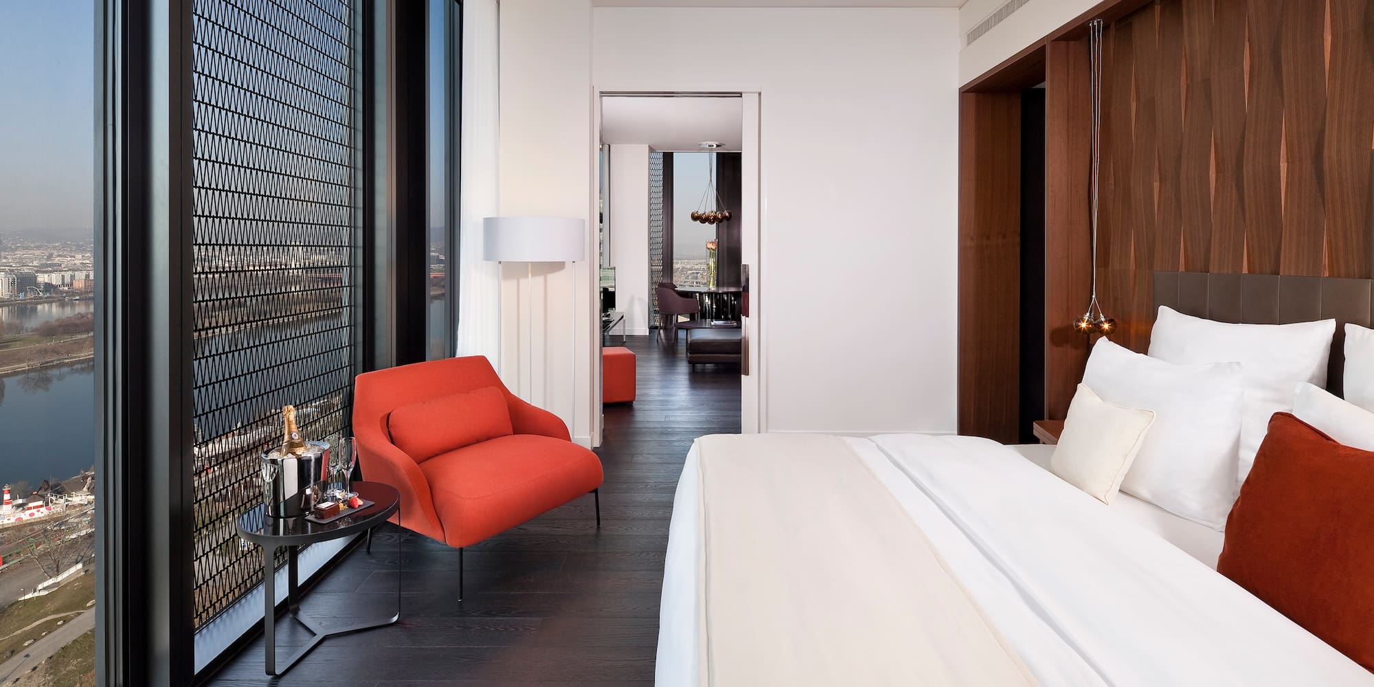 a bedroom with a bed and a chair