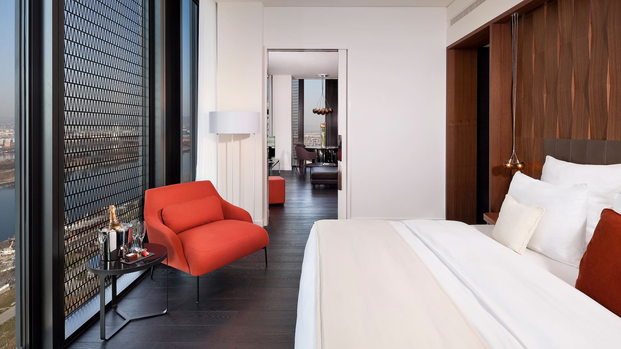 a bedroom with a bed and a chair