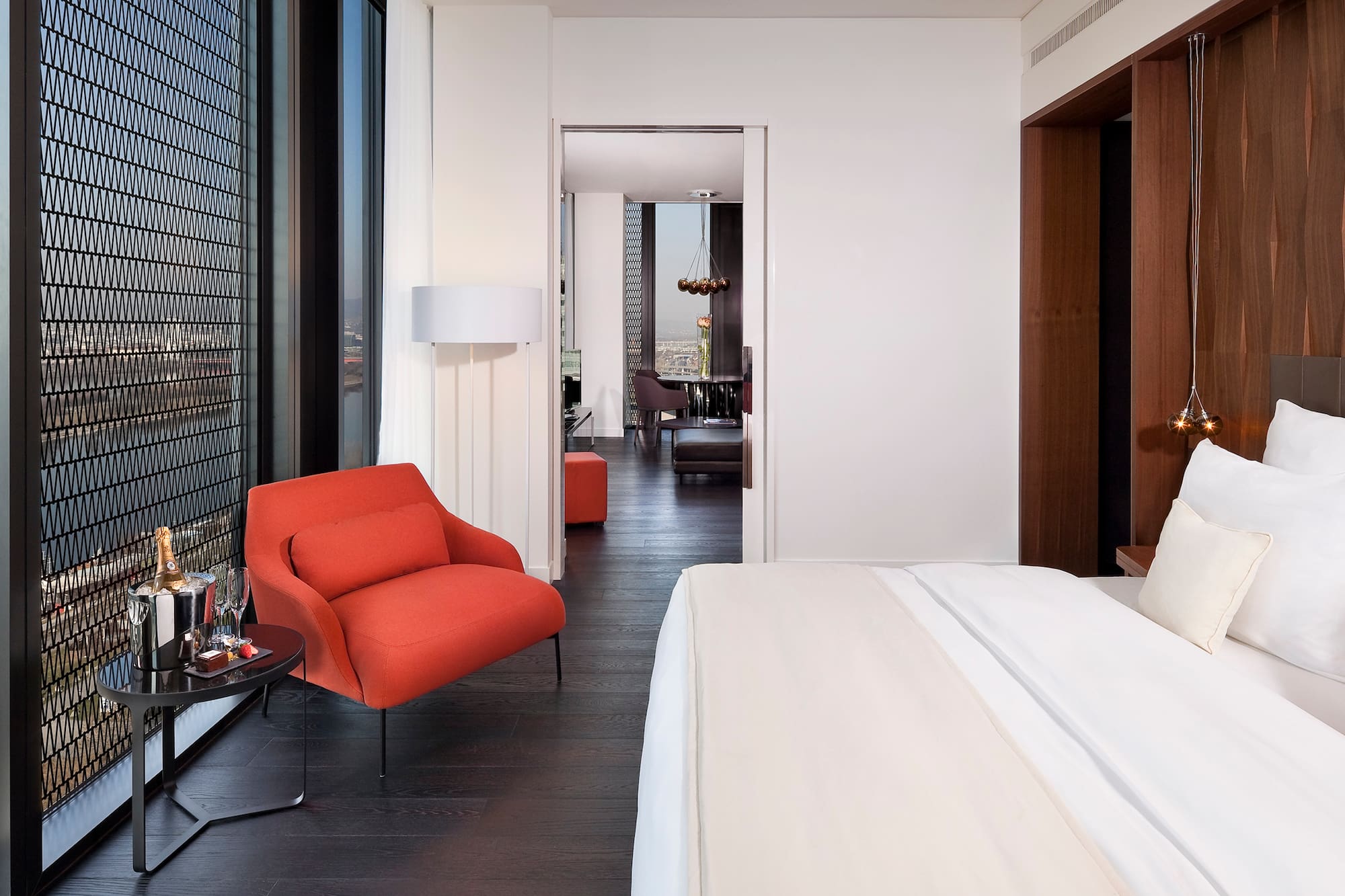 a bedroom with a bed and a chair