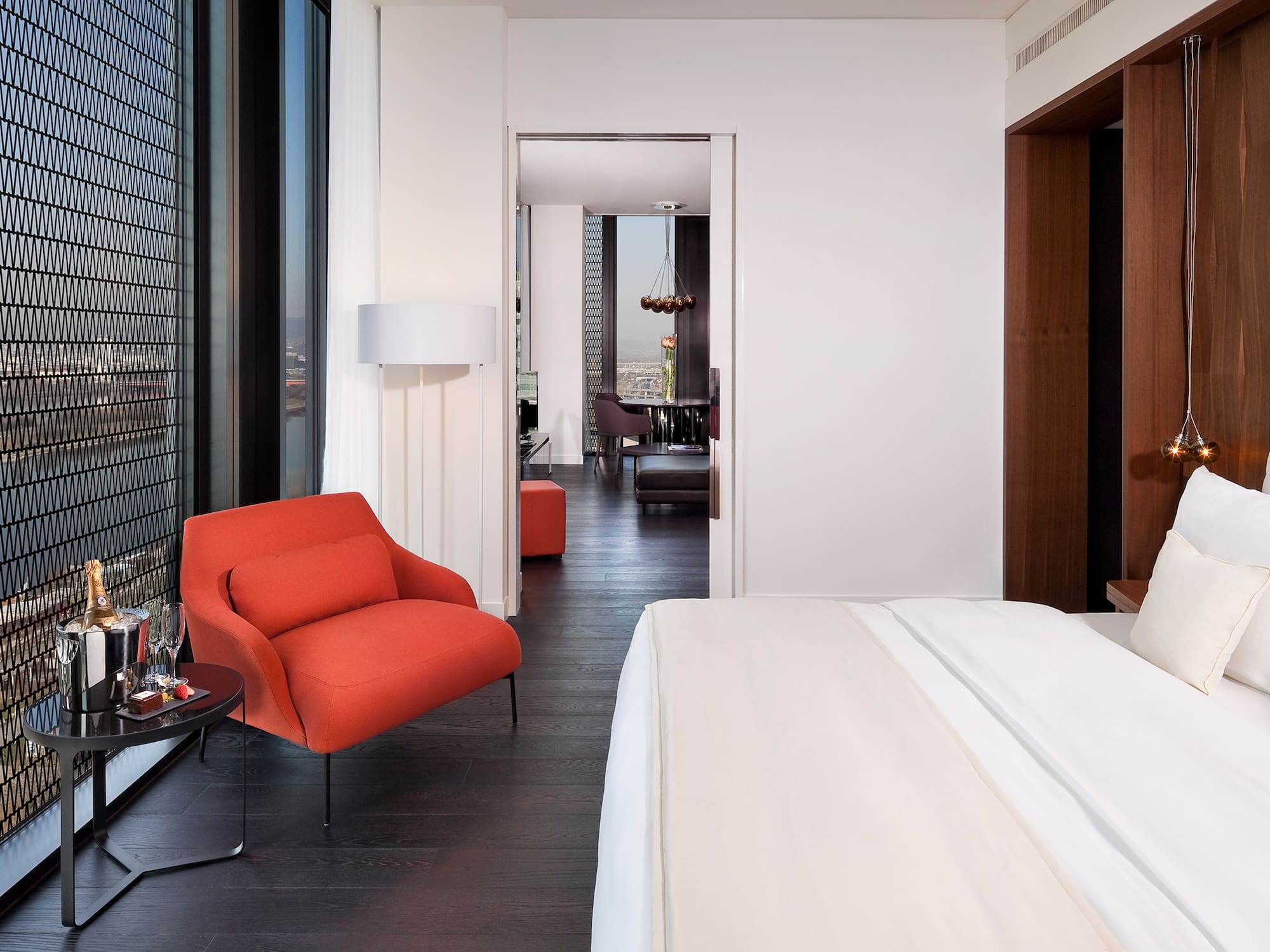 a bedroom with a bed and a chair