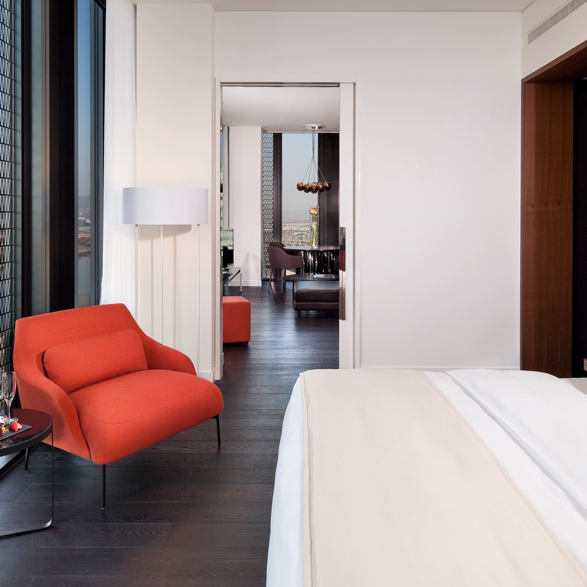 a bedroom with a bed and a chair