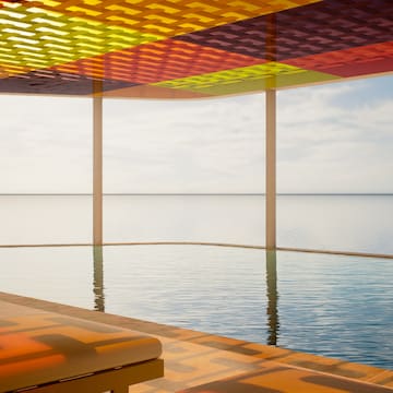 a pool with a colorful roof over it