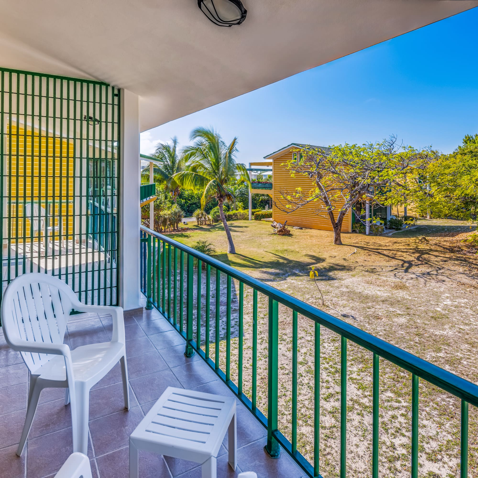 a white chair on a balcony