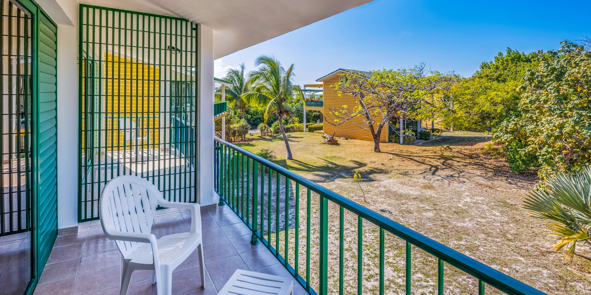 a white chair on a balcony