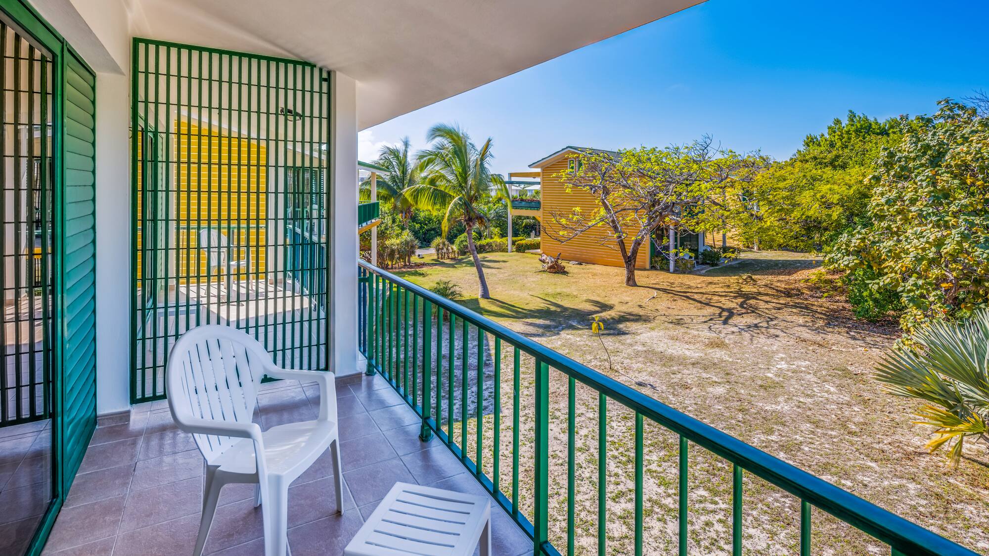 a white chair on a balcony