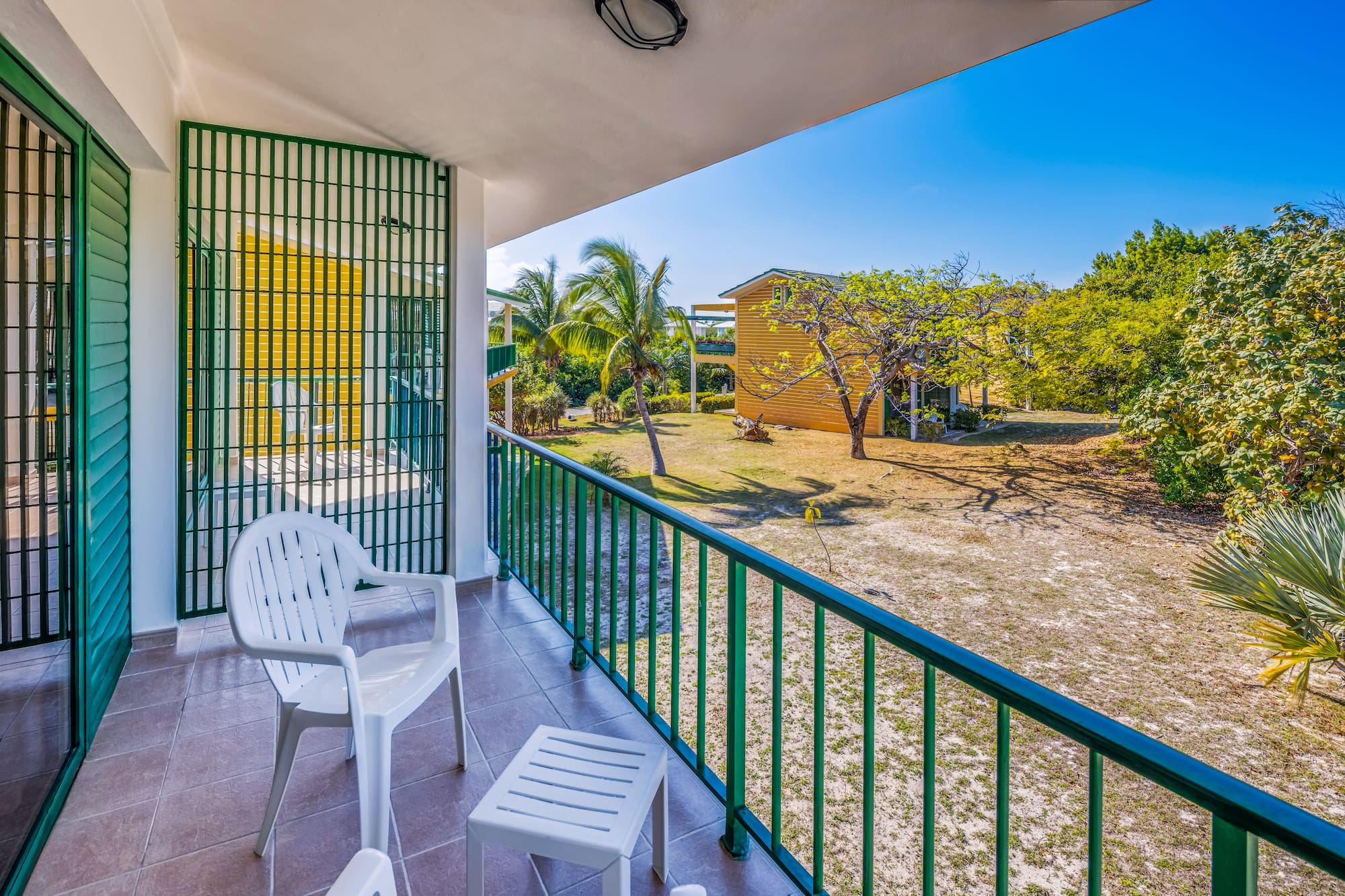 a white chair on a balcony