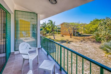 a white chair on a balcony