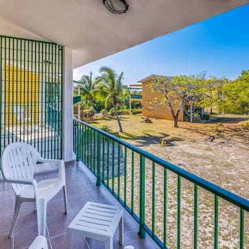a white chair on a balcony