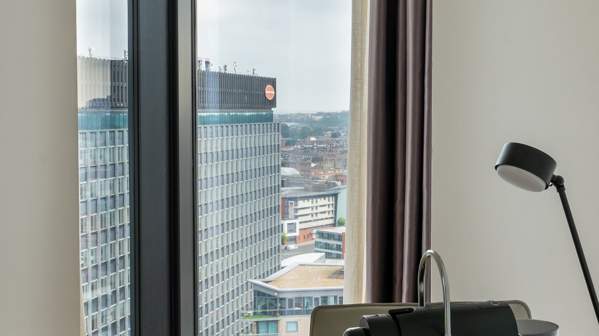 a coffee machine on a table with a window