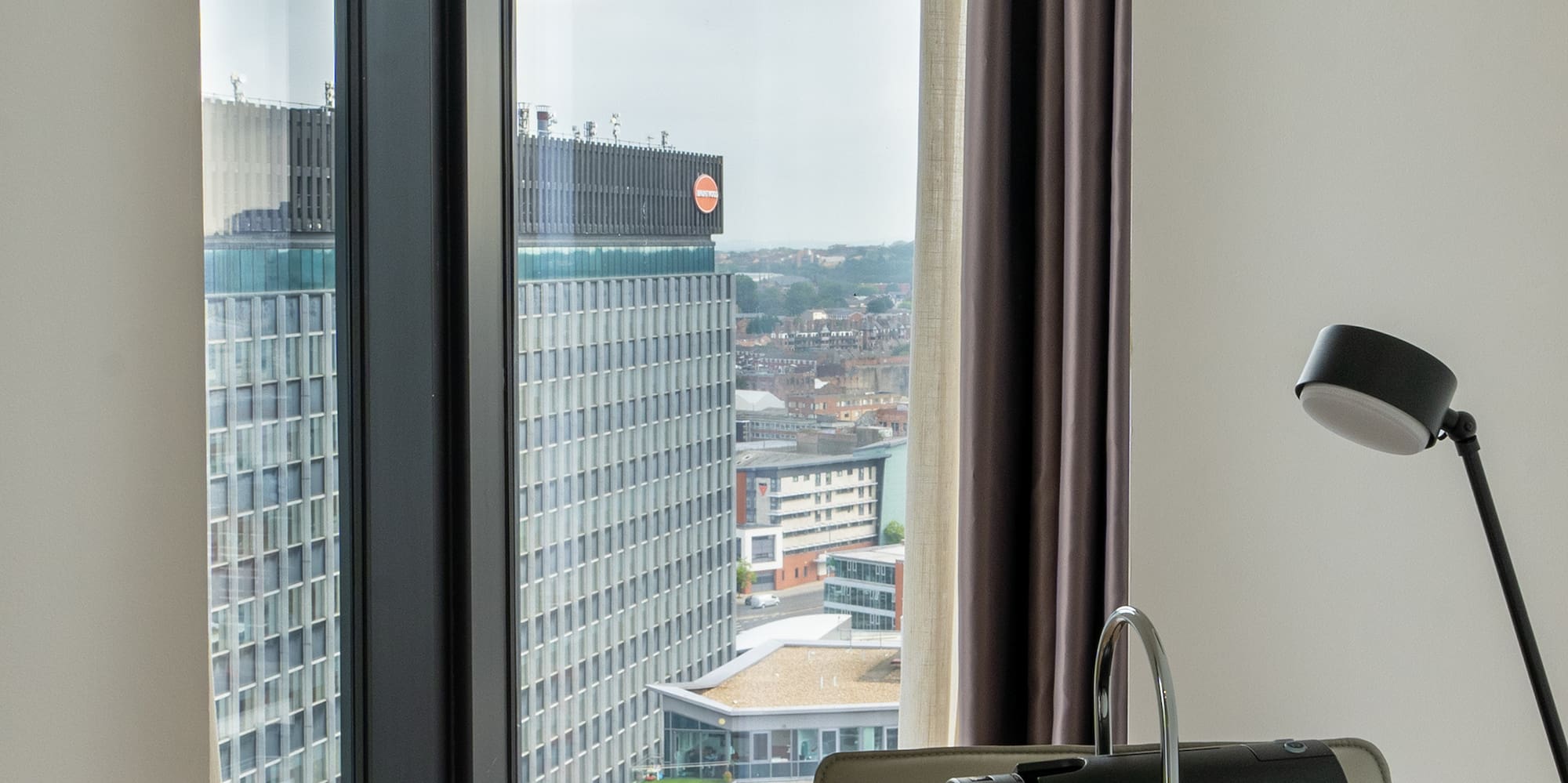 a coffee machine on a table with a window
