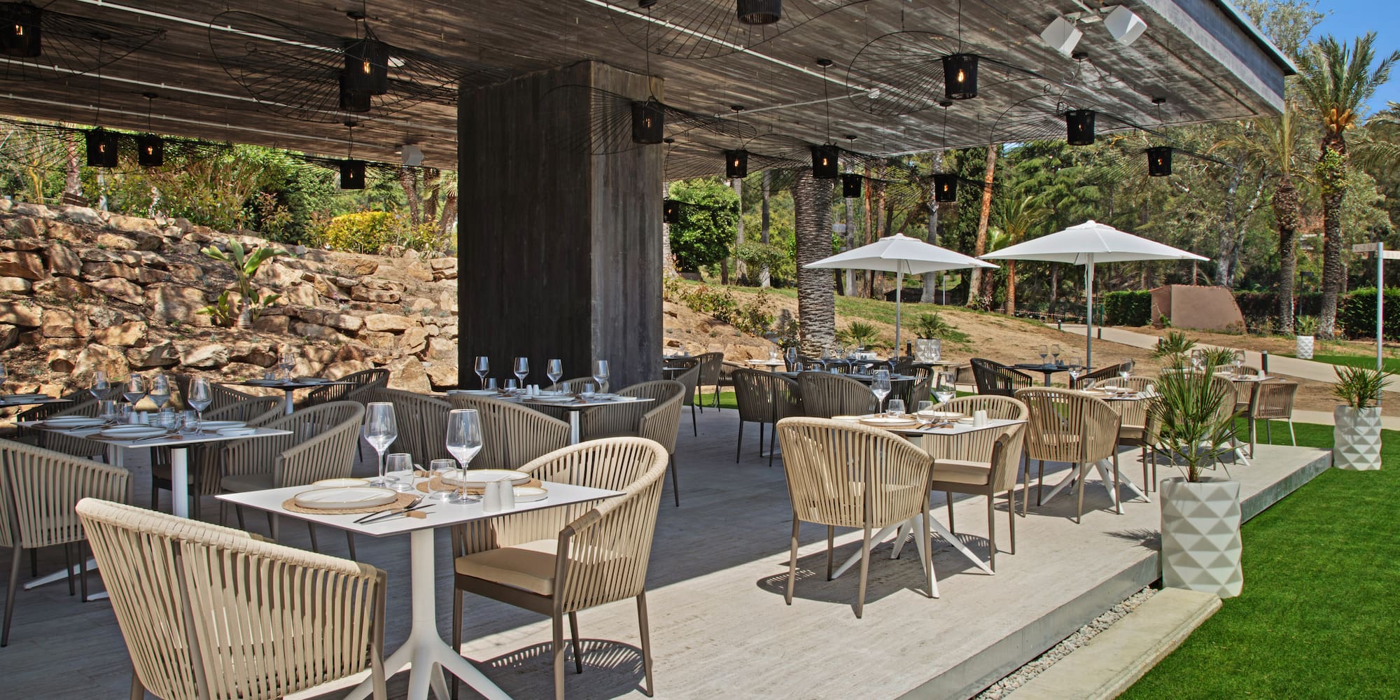 a patio with tables and chairs