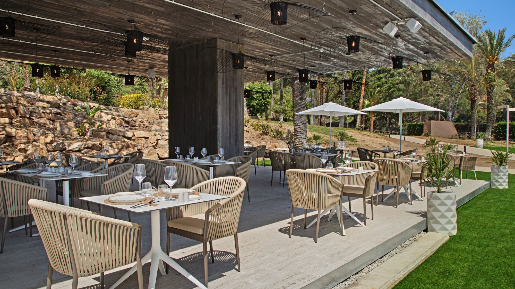 a patio with tables and chairs
