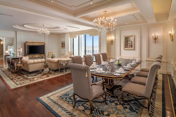 a room with a large table and chairs