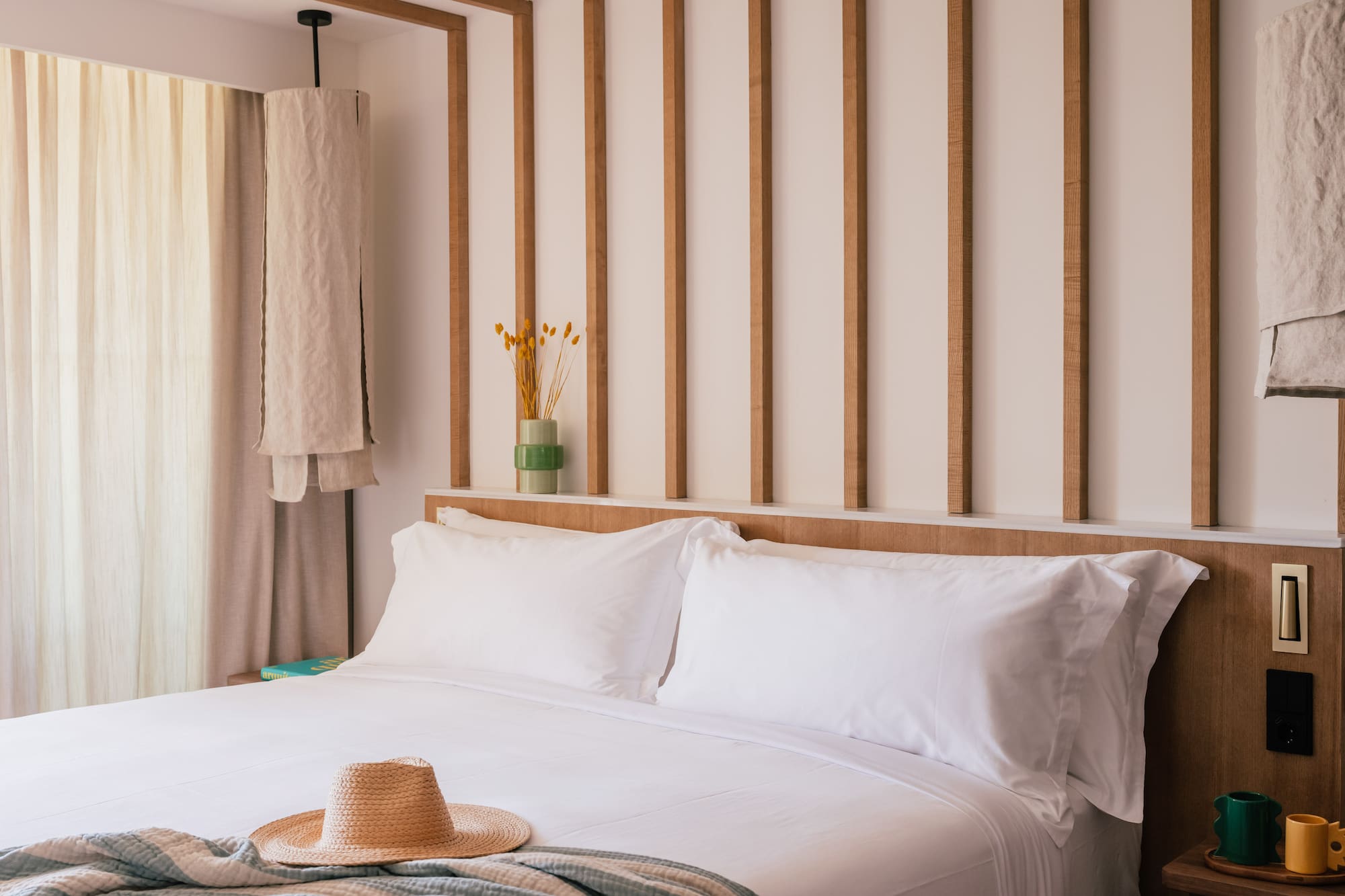 a bed with a hat on it