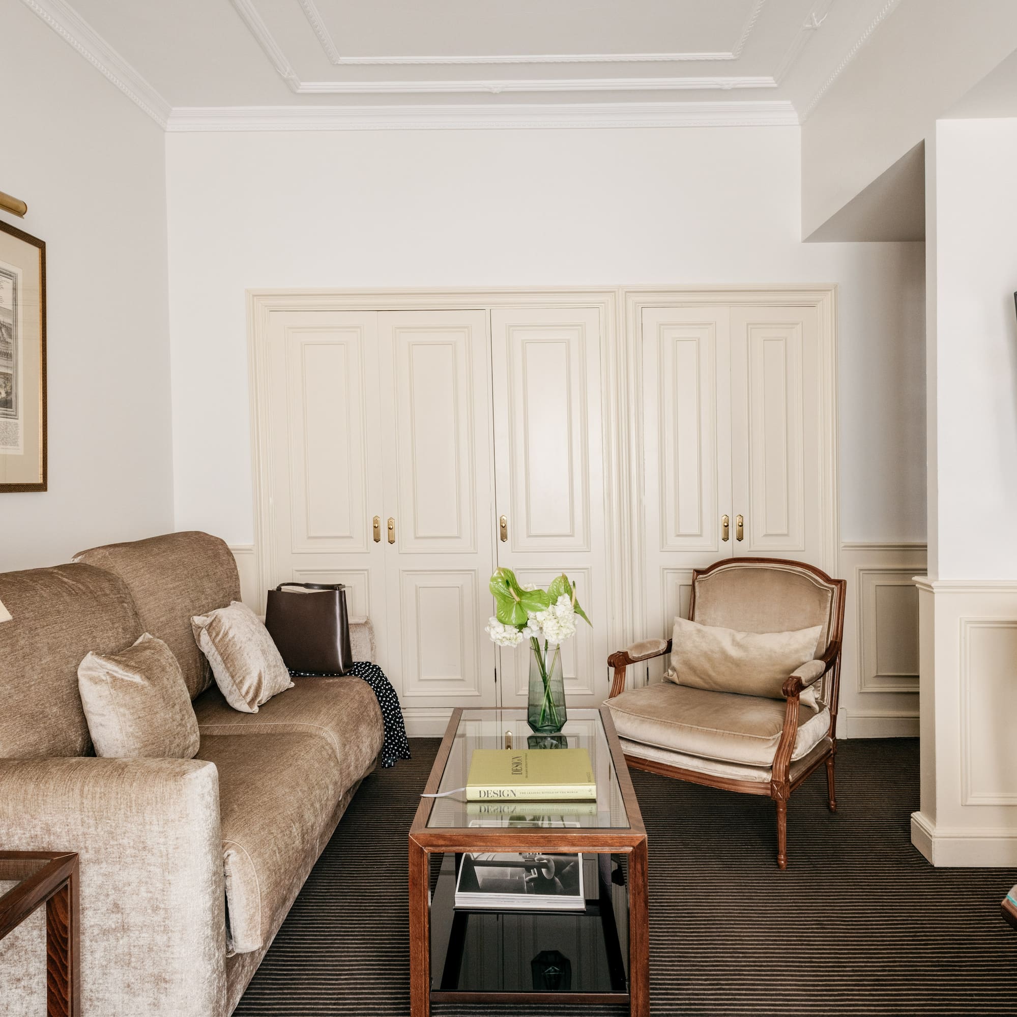 a living room with a couch and chairs