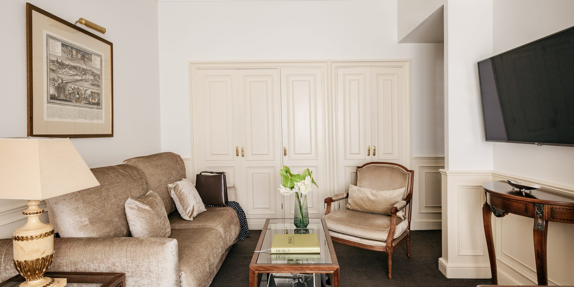 a living room with a couch and chairs