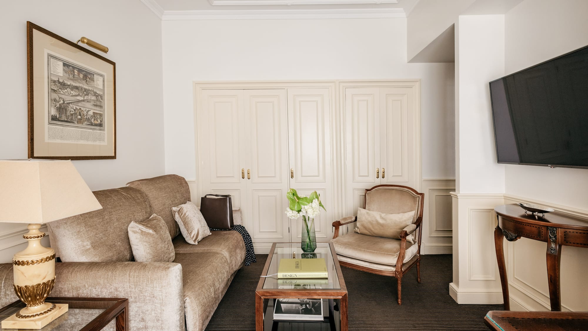 a living room with a couch and chairs