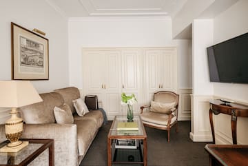 a living room with a couch and chairs
