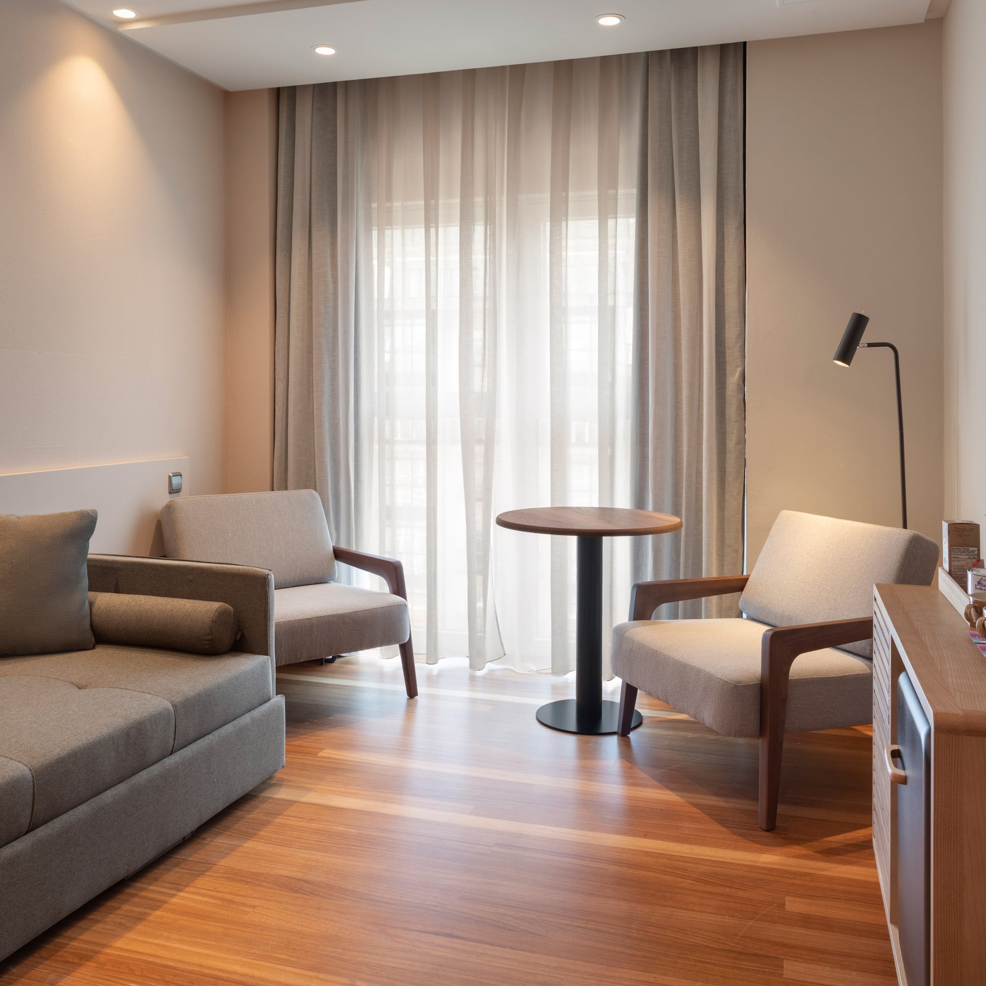 a living room with couches and a table