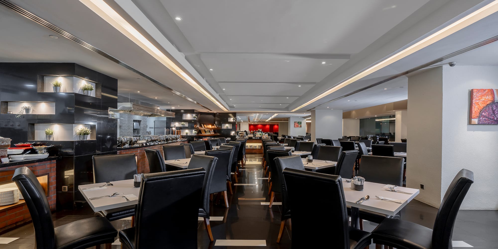 a restaurant with tables and chairs