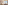 a room with a bed and a table with fruit on it