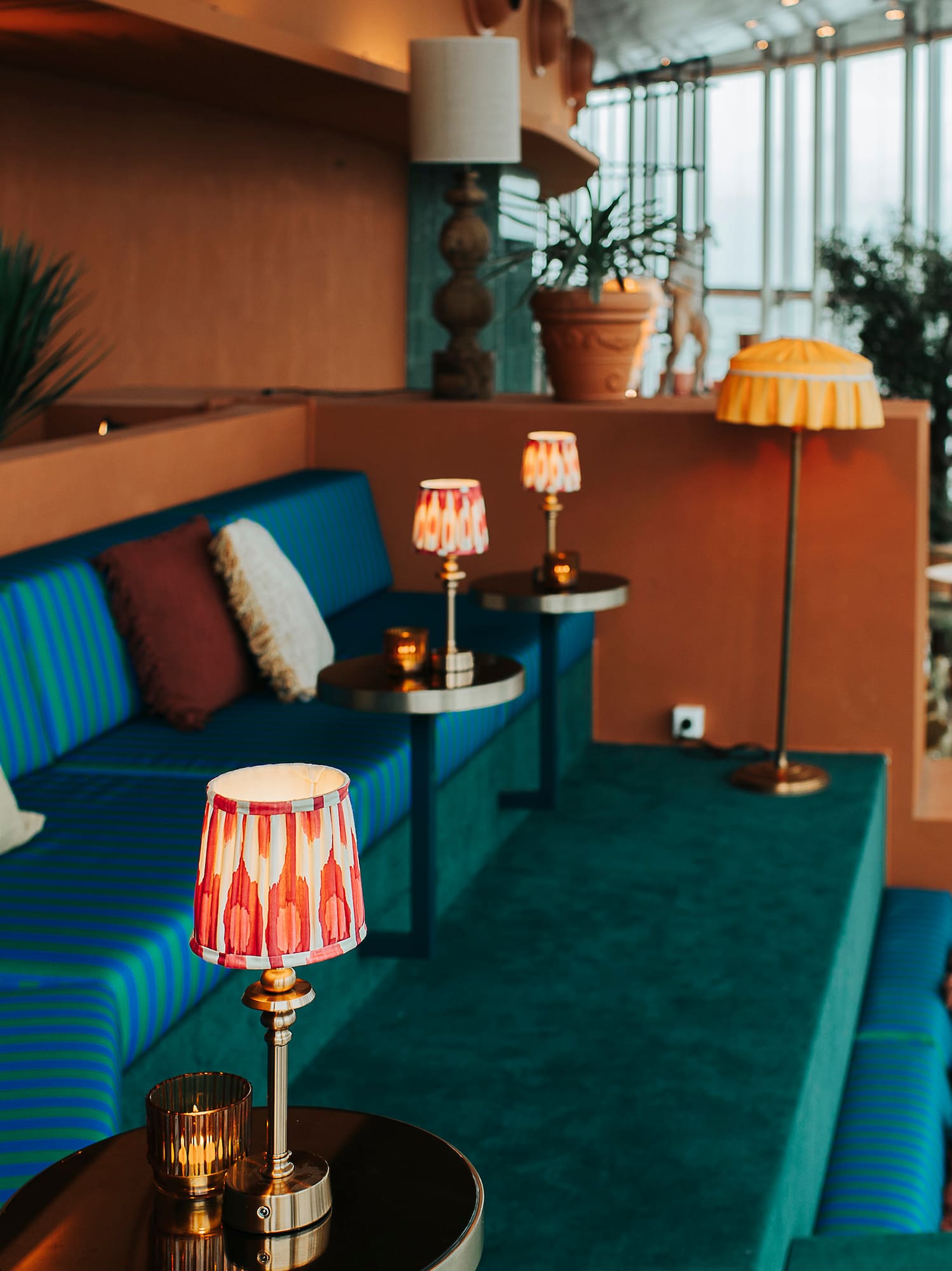 a room with a couch and a couch with lamps