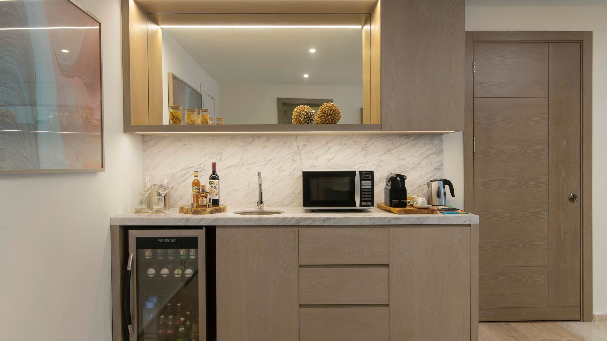 a kitchen with a sink and a refrigerator
