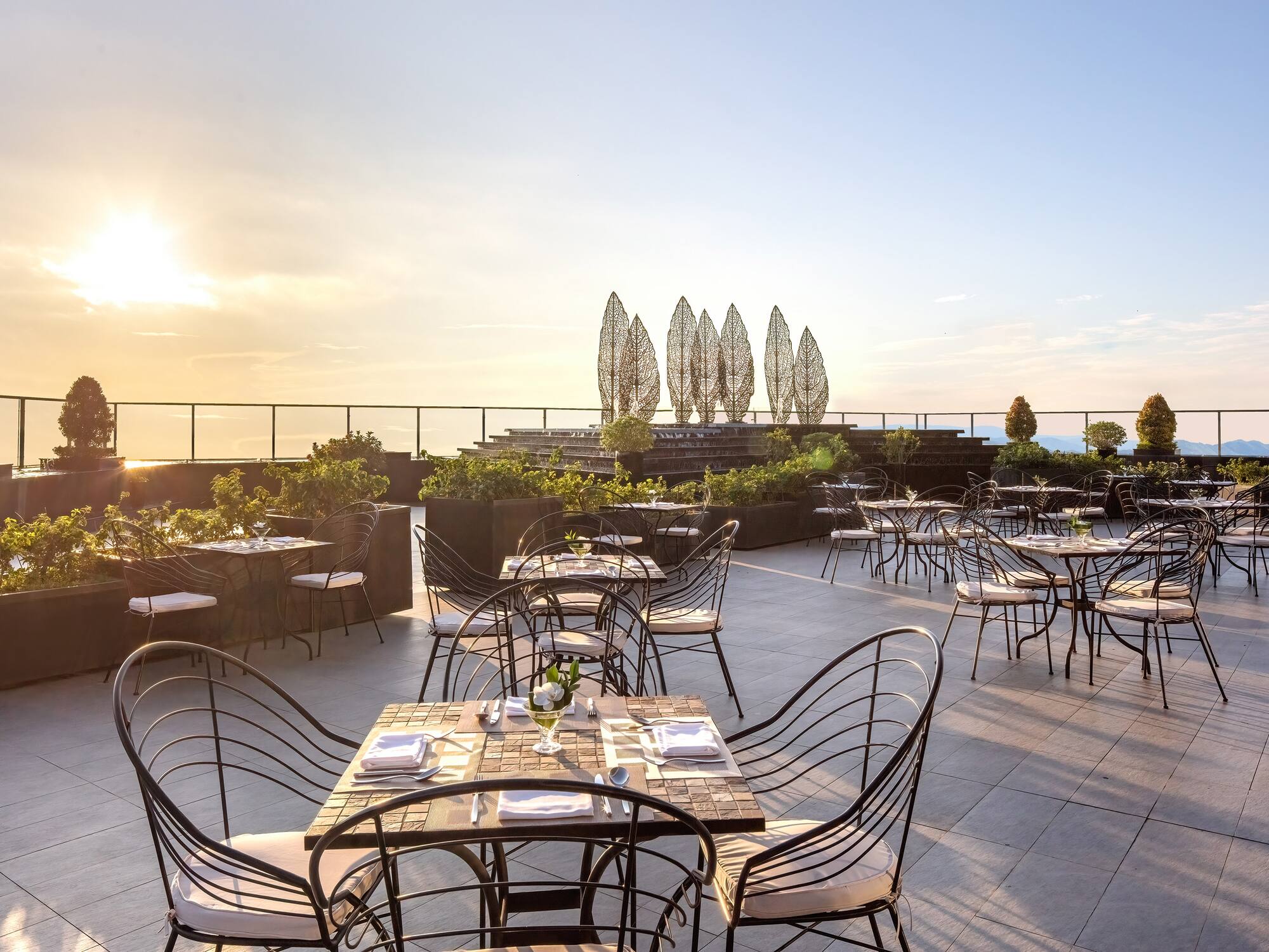 a restaurant with tables and chairs on a patio