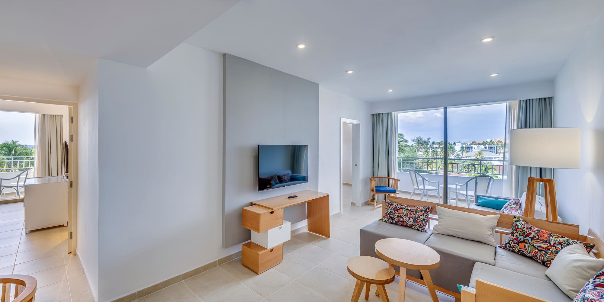 a living room with a television and a table