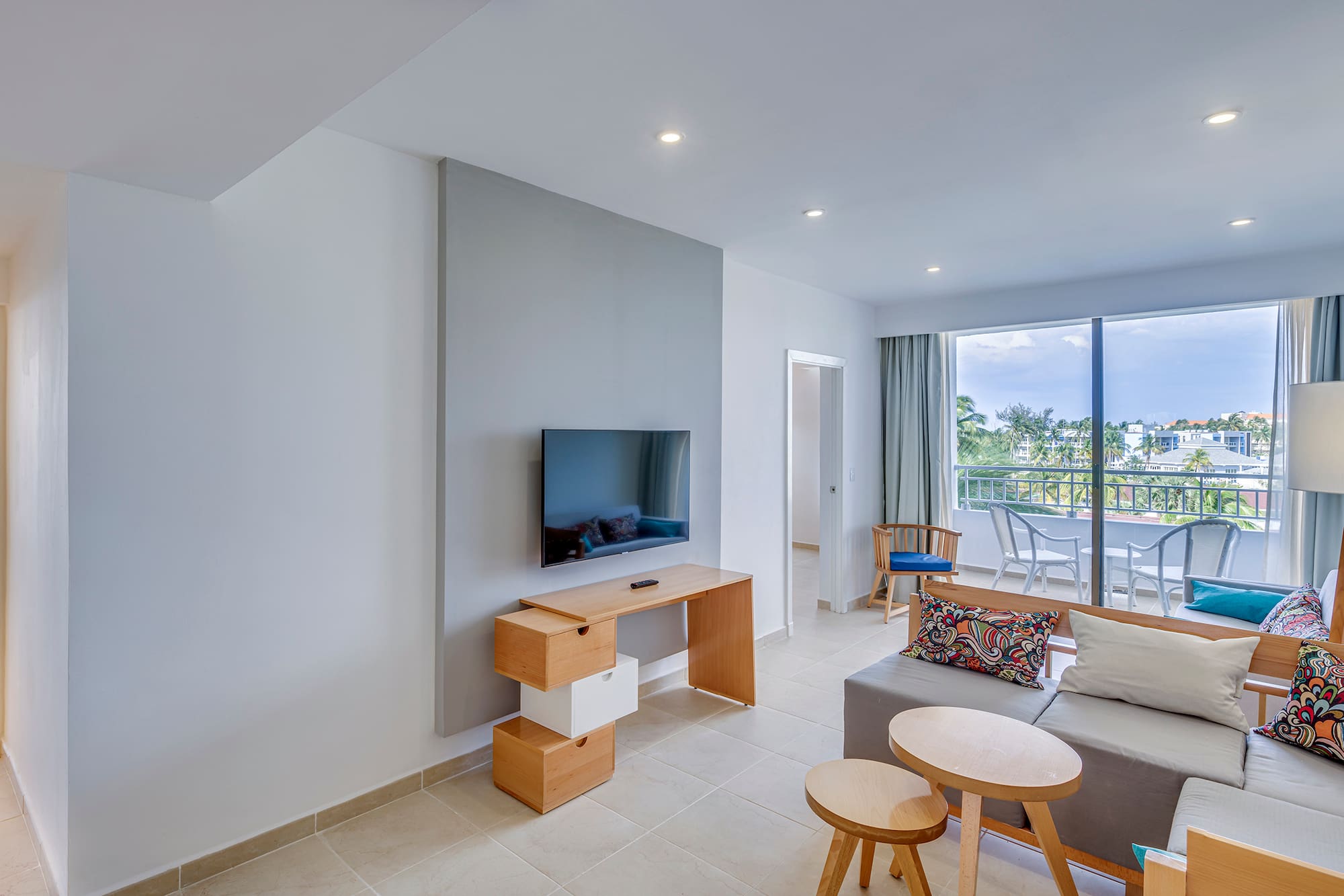 a living room with a television and a table