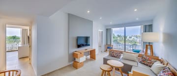 a living room with a television and a table