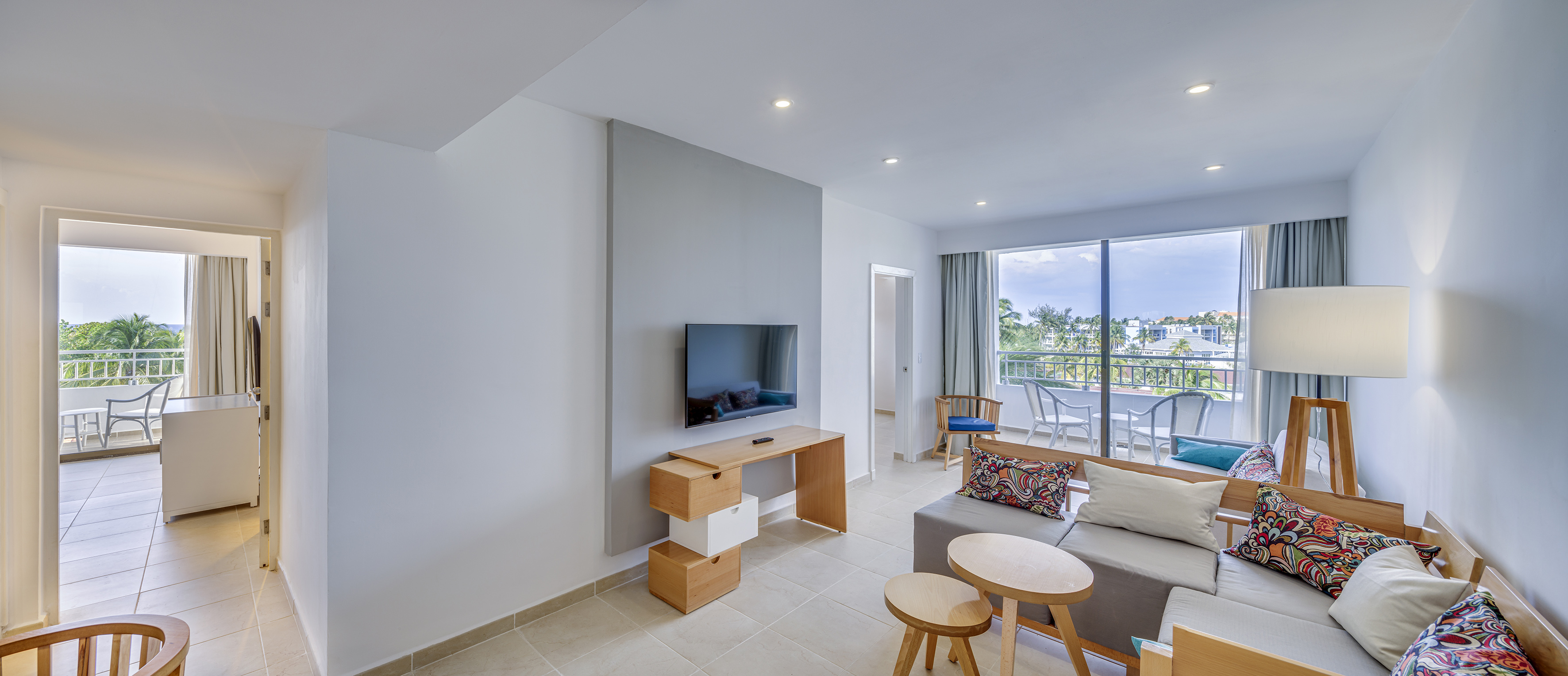 a living room with a television and a table