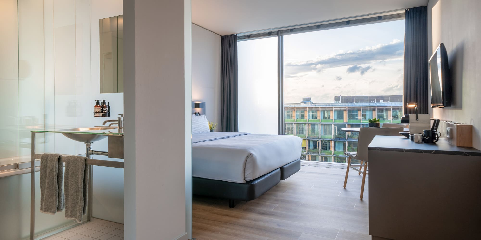 a bedroom with a large window