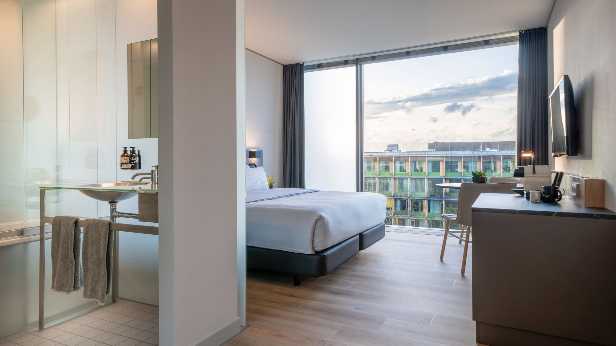 a bedroom with a large window