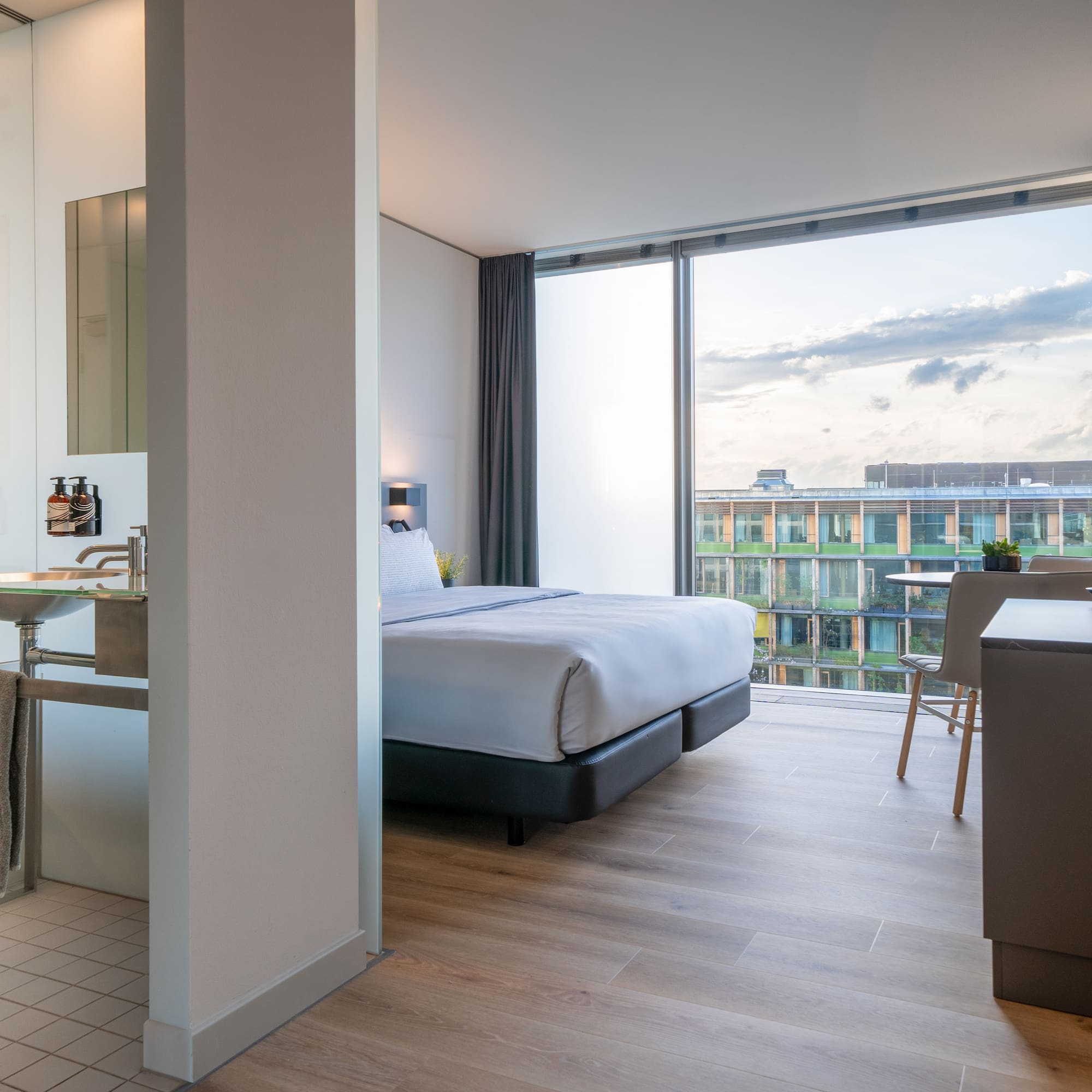 a bedroom with a large window