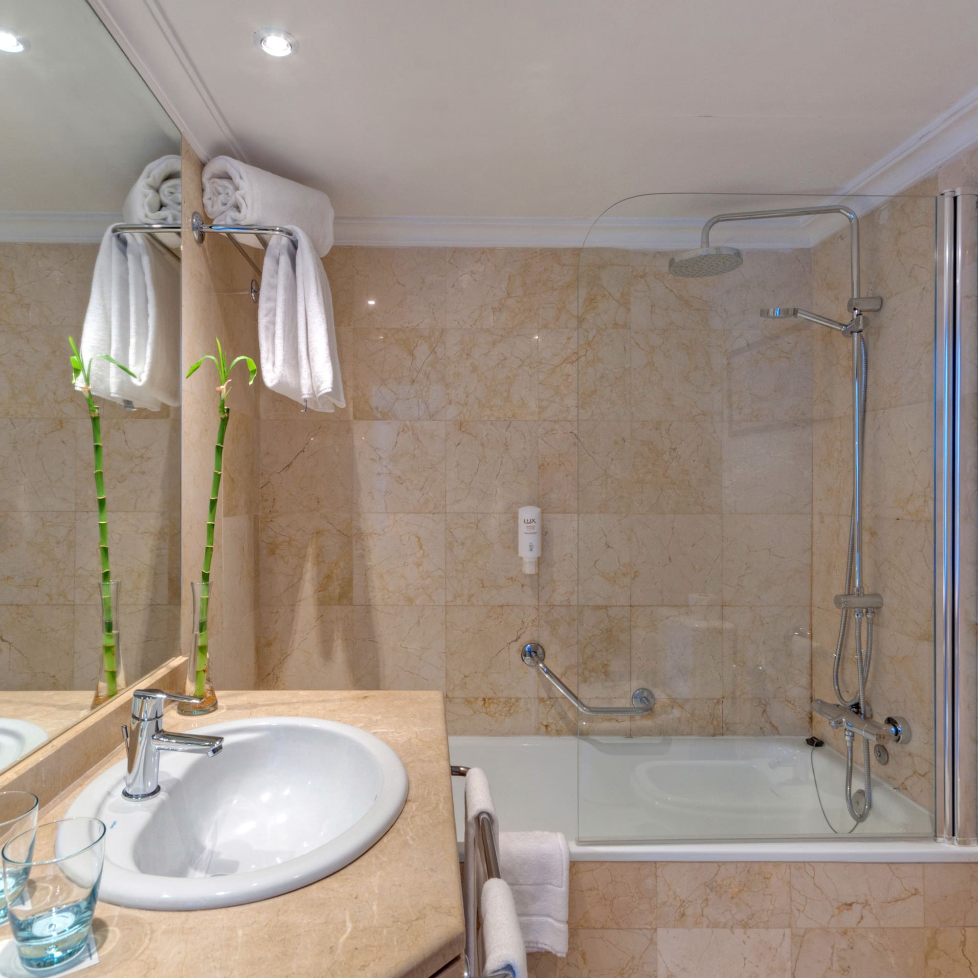 a bathroom with a sink and shower