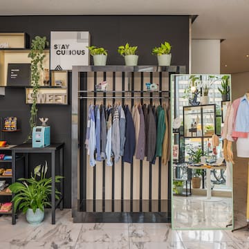 a store with a mannequin and clothes
