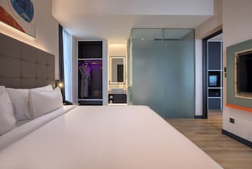 a room with a bed and a mirror