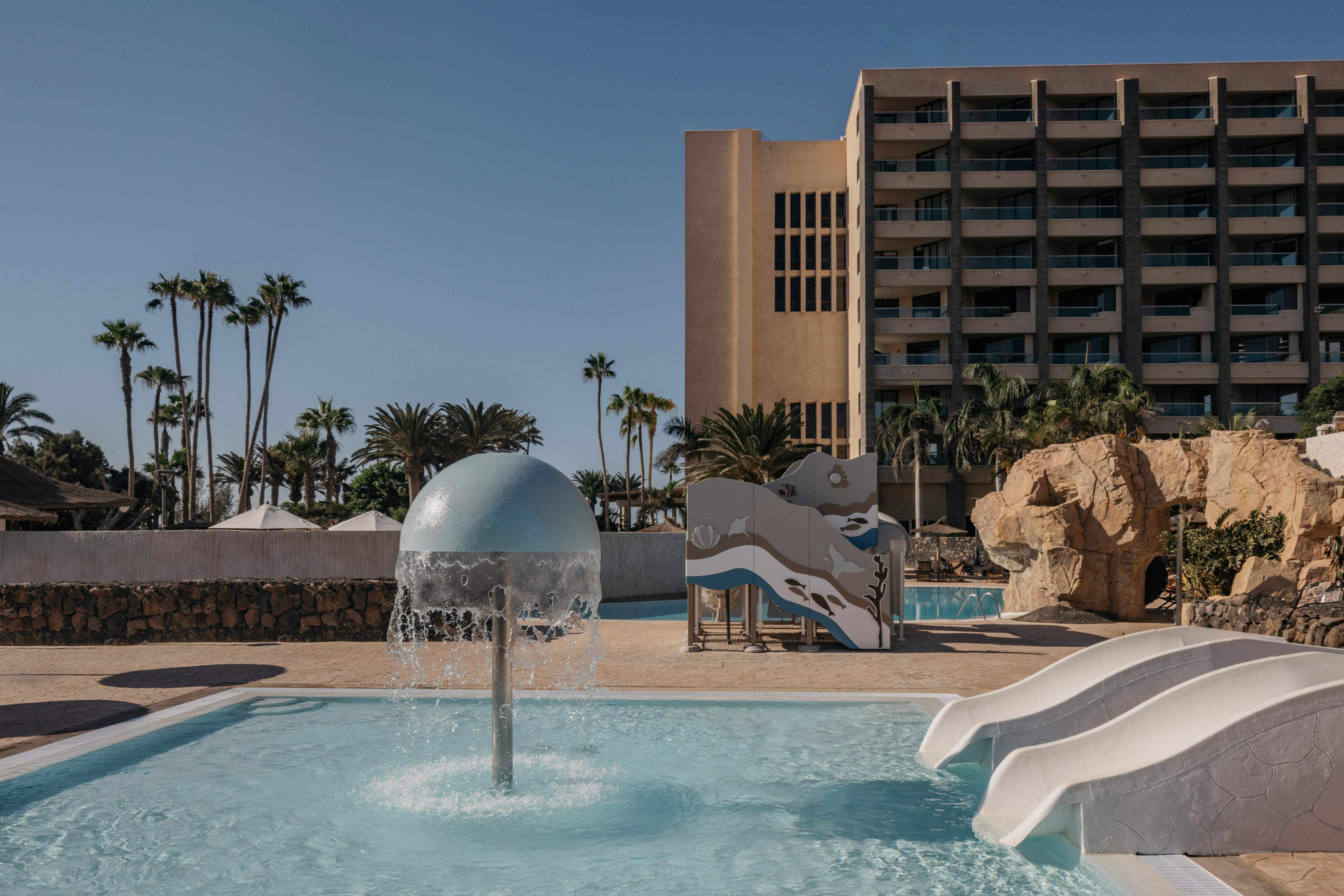 a water slide in a pool