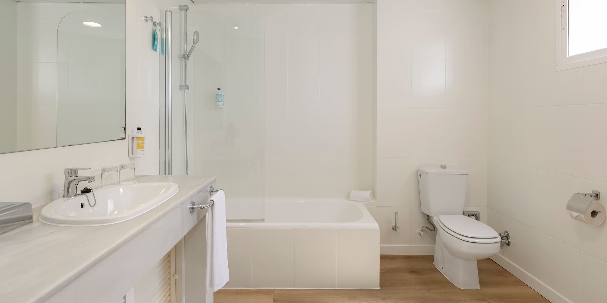 a bathroom with a sink toilet and bathtub