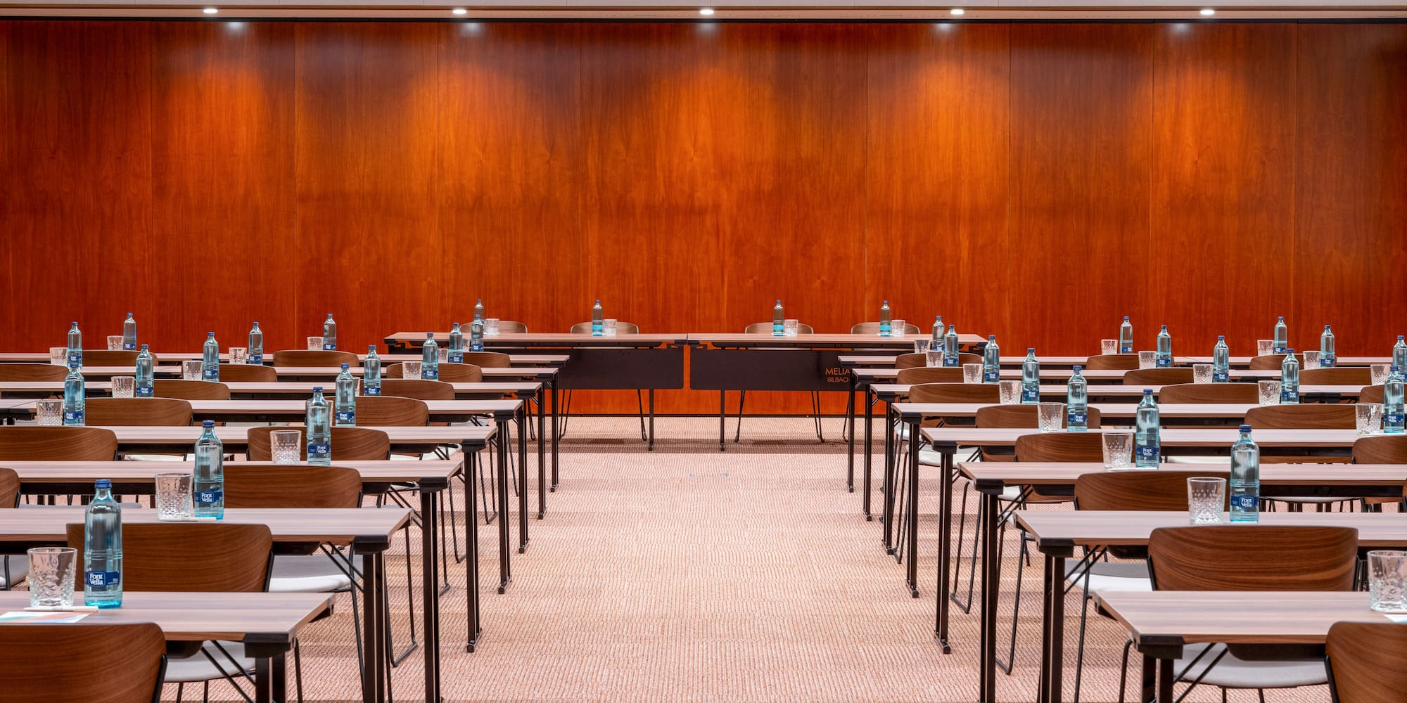 a room with many desks and chairs