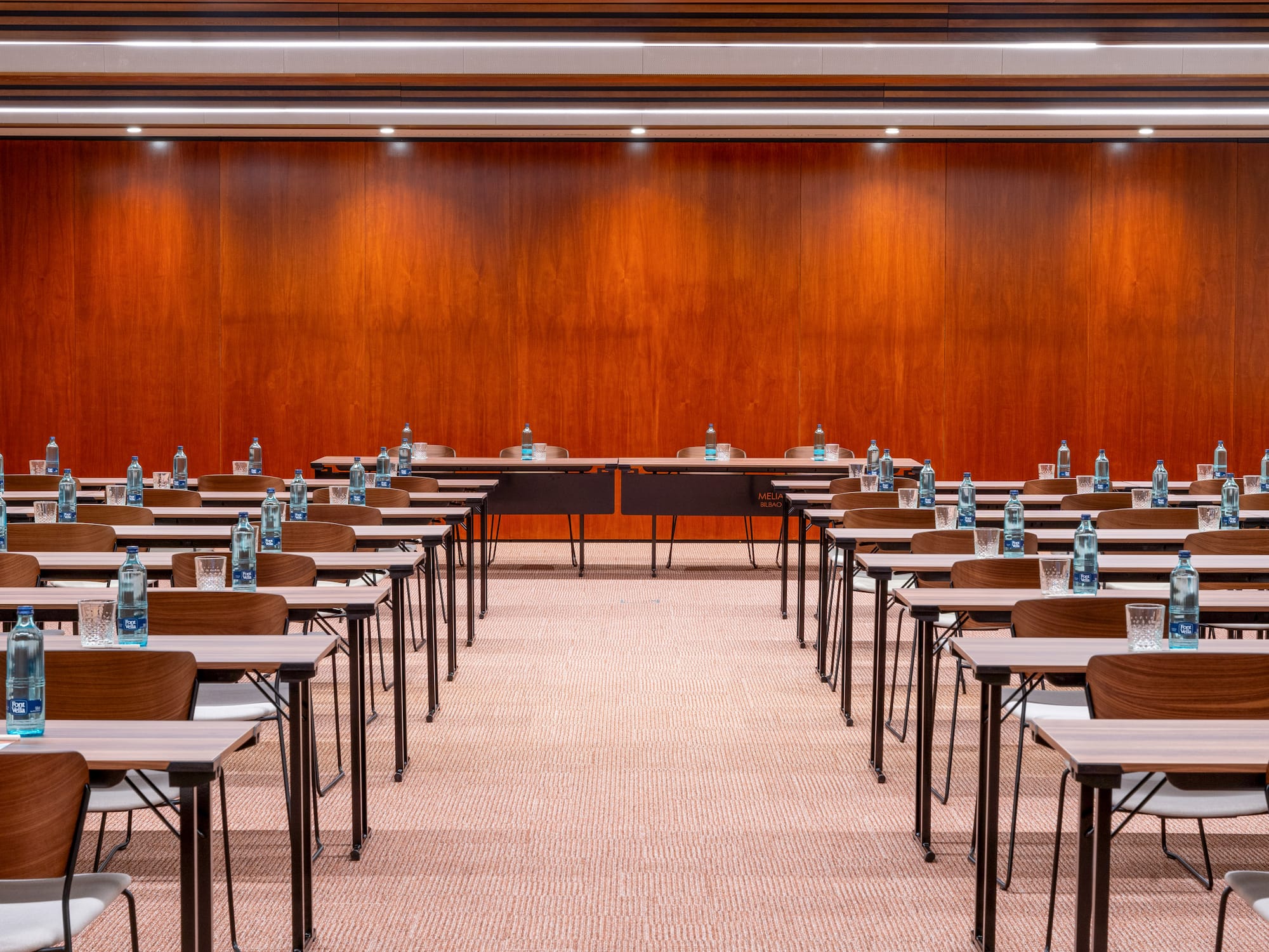 a room with many desks and chairs