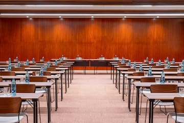 a room with many desks and chairs