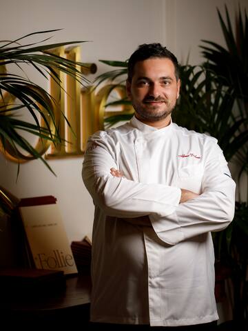 a man in a white coat