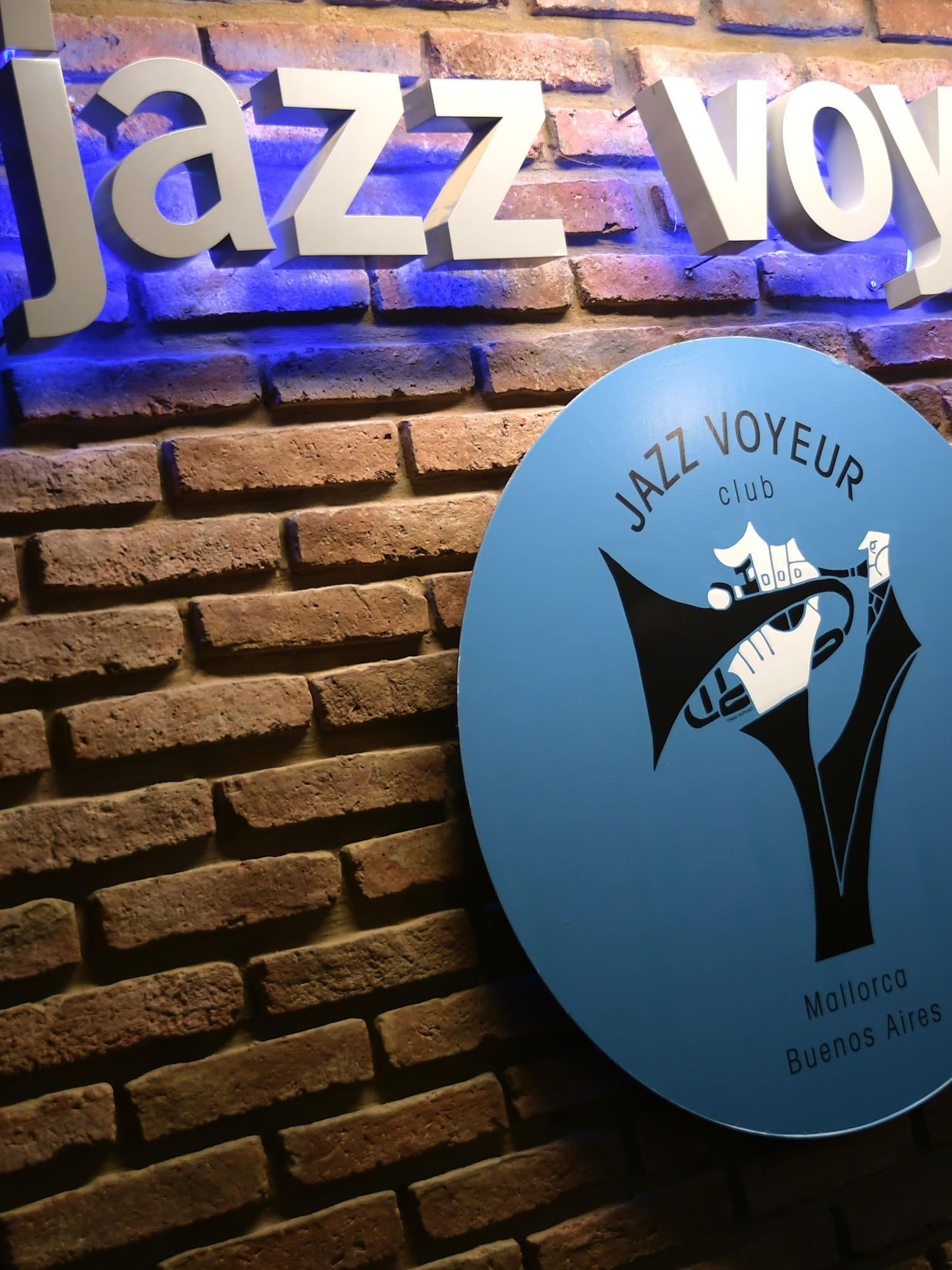 a sign on a brick wall