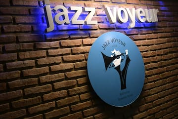 a sign on a brick wall