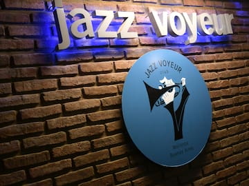 a sign on a brick wall